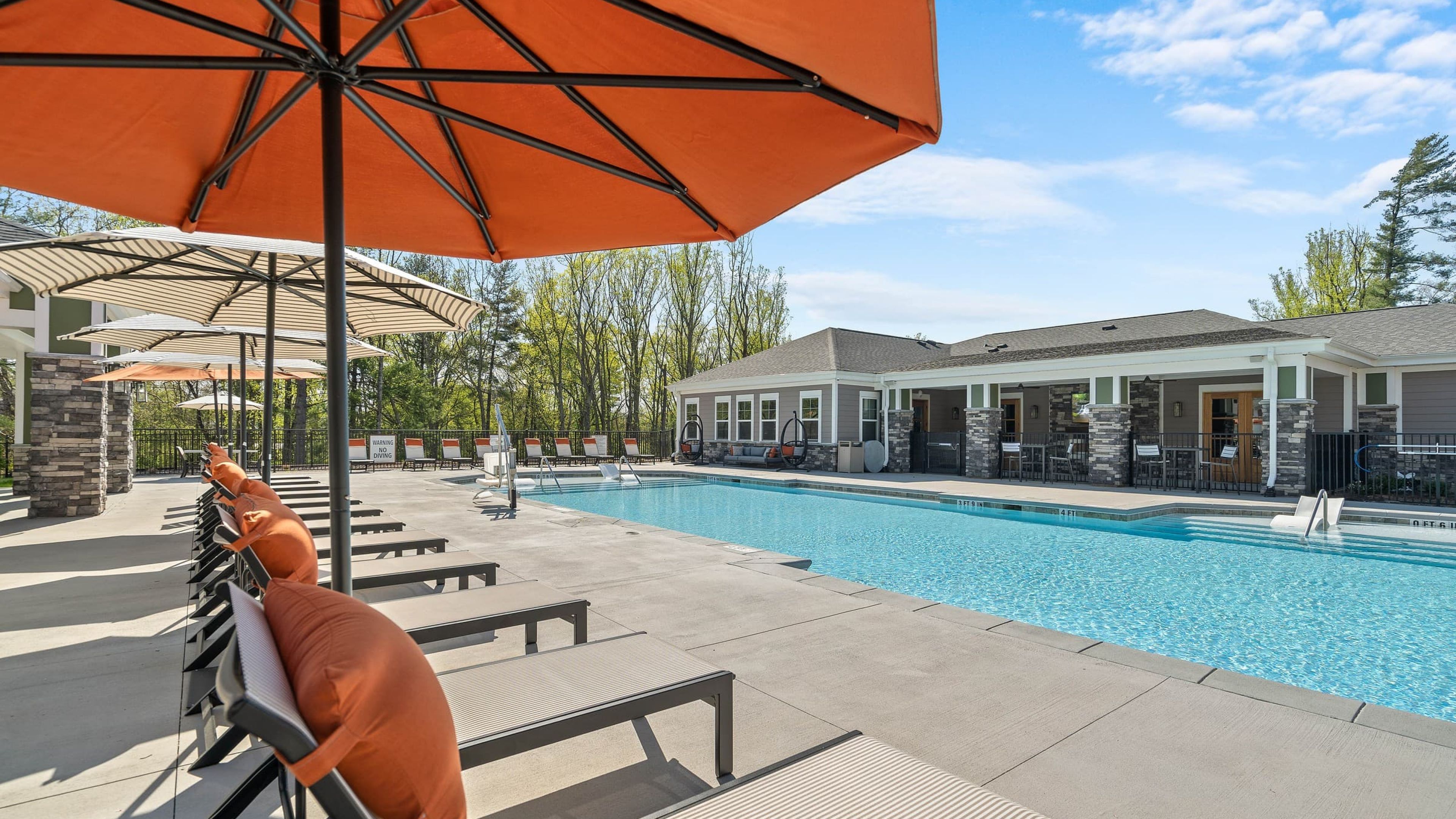 Hawthorne at Haywood luxury outdoor pool with in-pool lounge chairs and surrounding seating